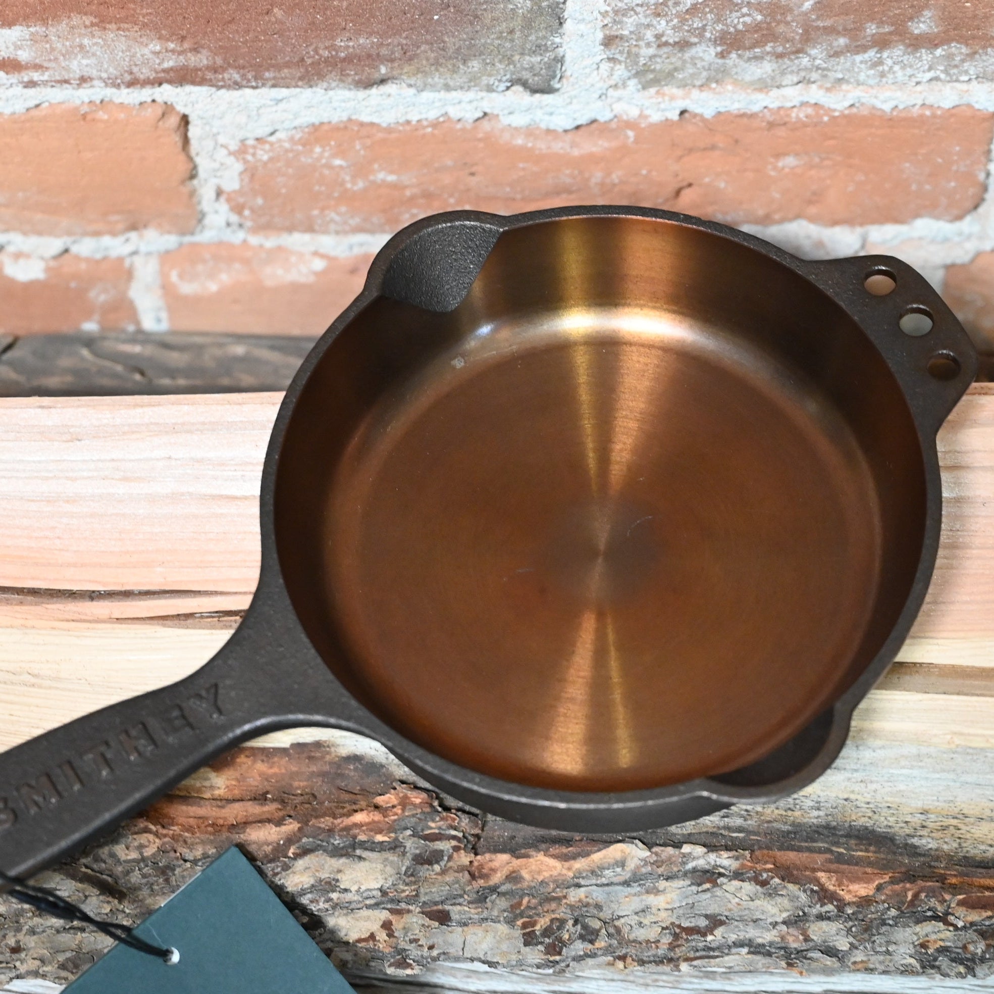View of Smithey Ironware No. 6 Cast Iron Skillet with polished interior and ergonomic handle