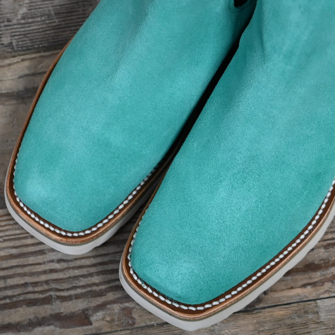 View of Macie Bean ladies turquoise suede wedge bootie with cutter toe and white swedge sole