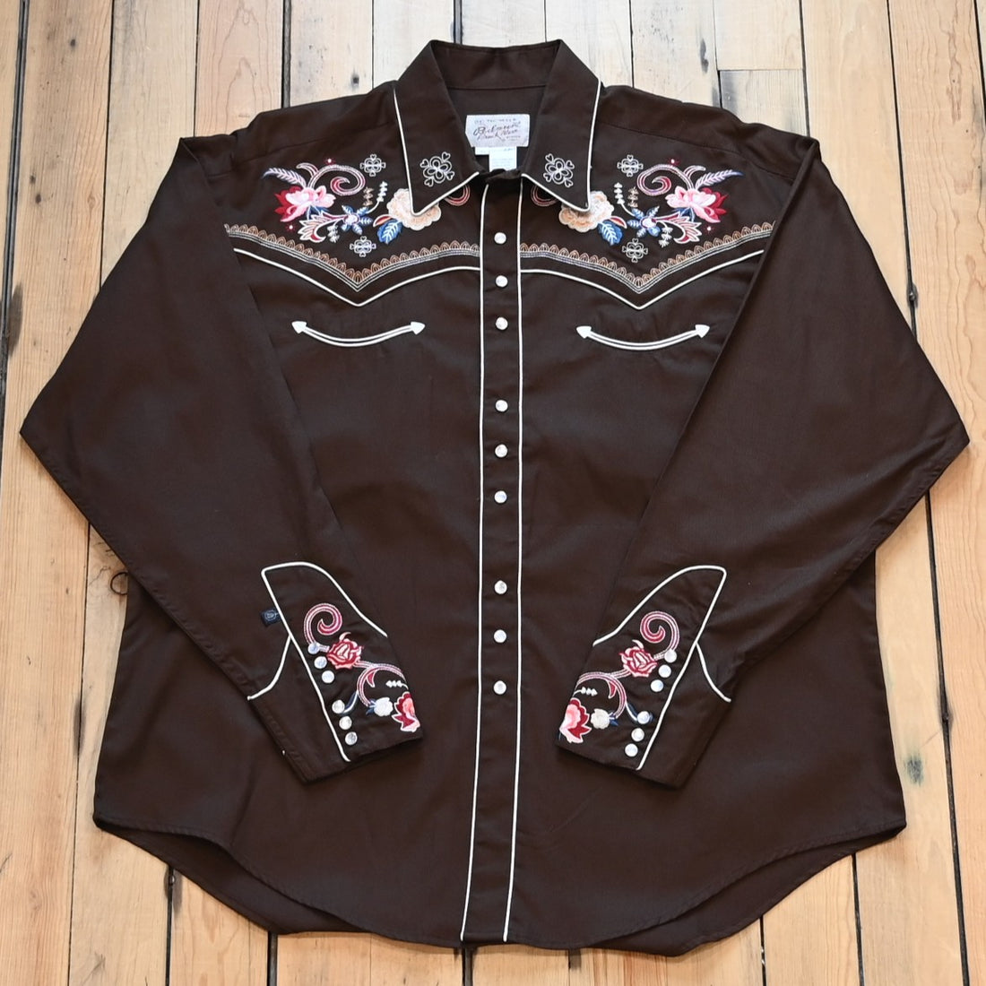 View of Brown Western shirt with tonal floral embroidery and Western smile pockets