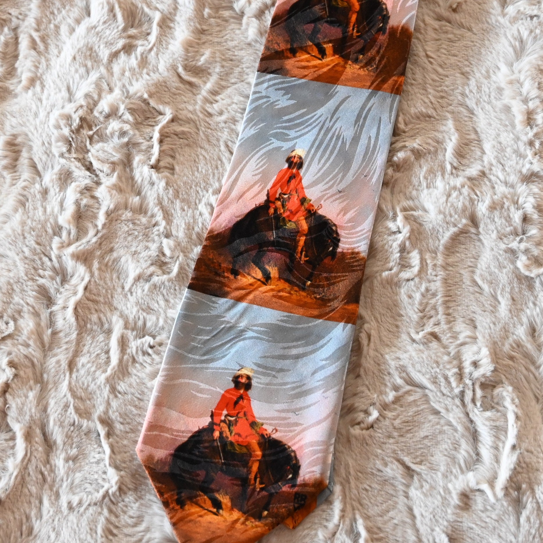 View of Silk necktie with mountain man illustration and pine tree motif by Rockmount