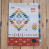 Pendleton Wild Blooms child-sized wool blanket in White/Coral Multi floral design.