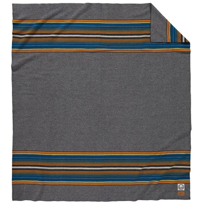 View of Pendleton Olympic Grey National Park Blanket (full size) with heather tones and park stripes