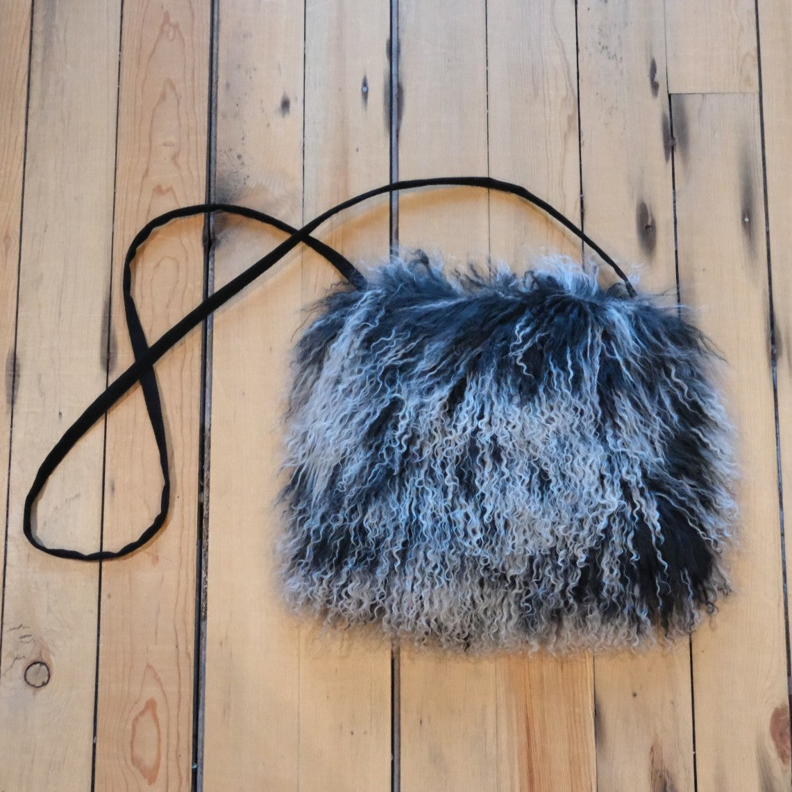 Morris Kaye Black and White Tibetan Lamb Fur Muff Bag at Atomic 79 Western Gear.