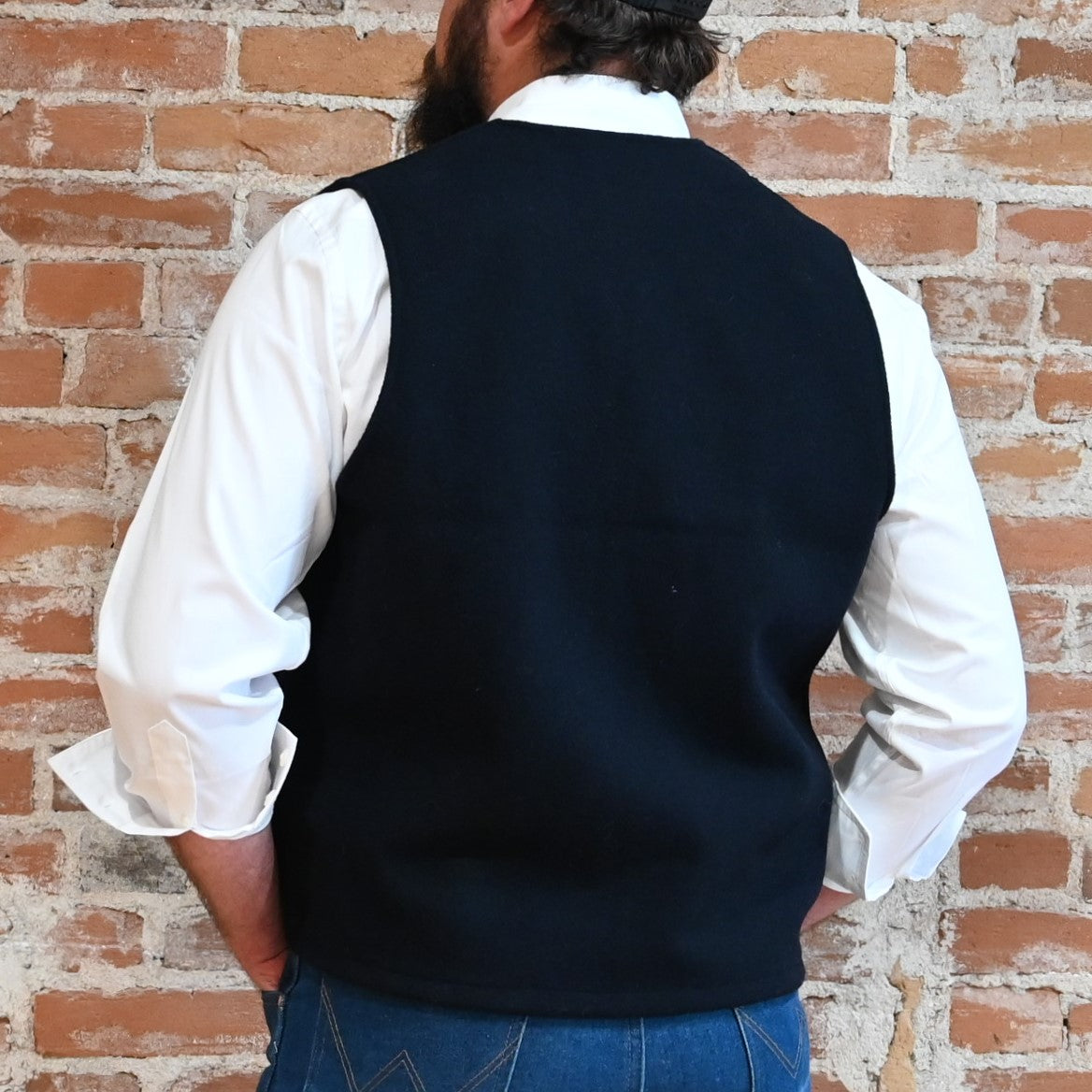 Filson Mackinaw Wool Vest in Dark Navy featuring V-neckline, button-front closure, and multiple pockets.

