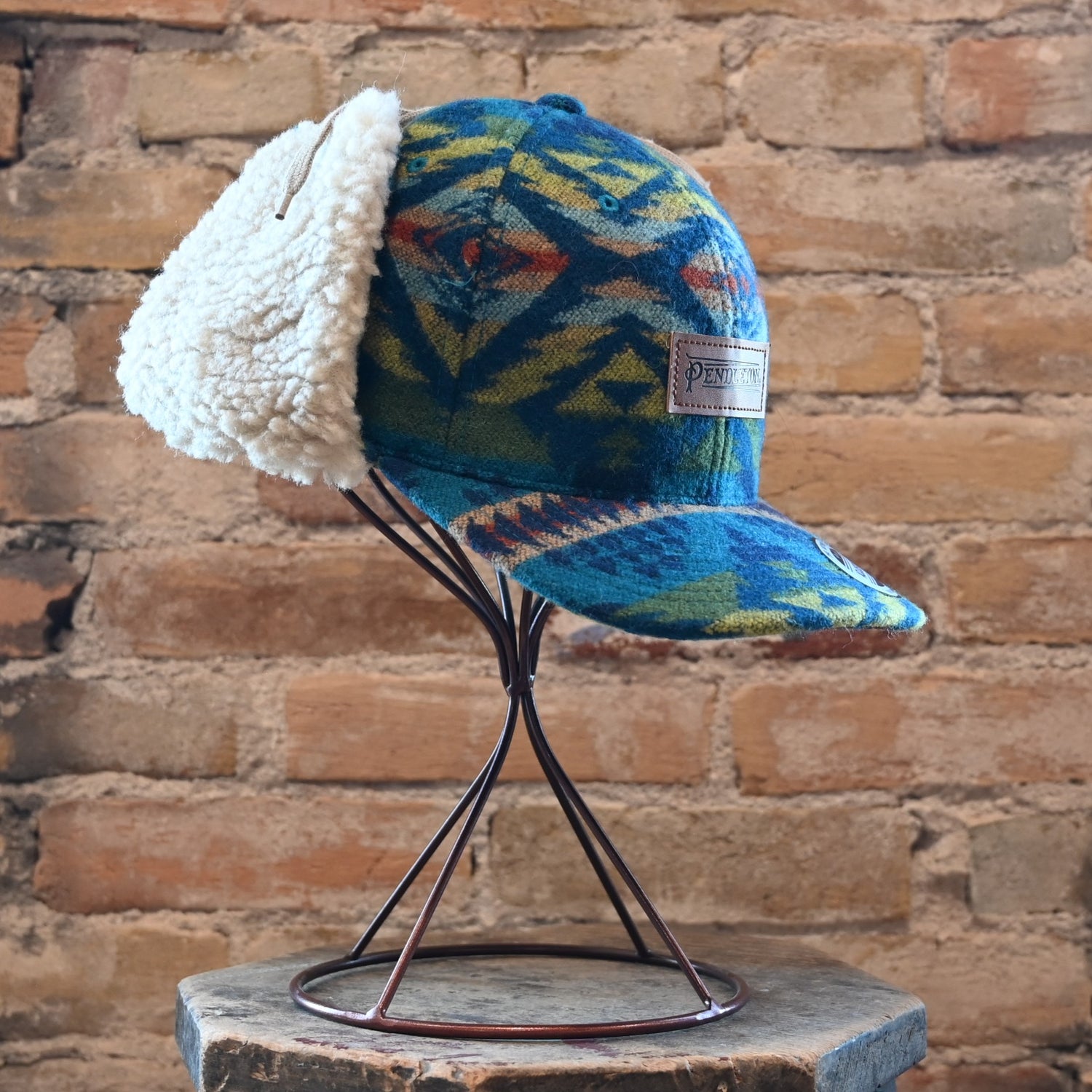 View of Pendleton Diamond Desert wool cap with sherpa ear flaps and tie closure