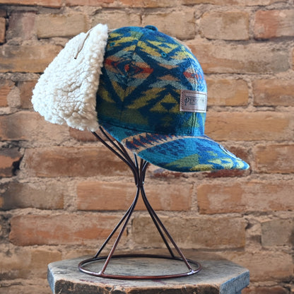 View of Pendleton Diamond Desert wool cap with sherpa ear flaps and tie closure