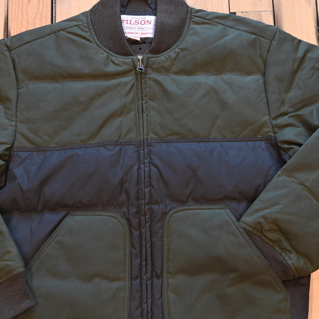 Filson down bomber jacket in otter green, waxed cotton shell with insulated down core