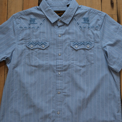 Howler Bros Crosscut Deluxe Shortsleeve Snapshirt in Surfbird: Sky Oxford Dobby.