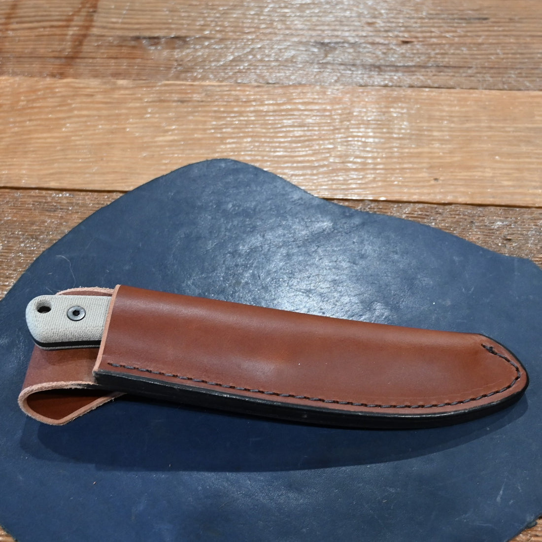 ESEE Ashley Emerson hunting knife with 1095 carbon steel blade and leather sheath, 2025 edition