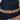 Adjustable Sambboho Maui beaded hatband styled on a western felt hat at Atomic 79.