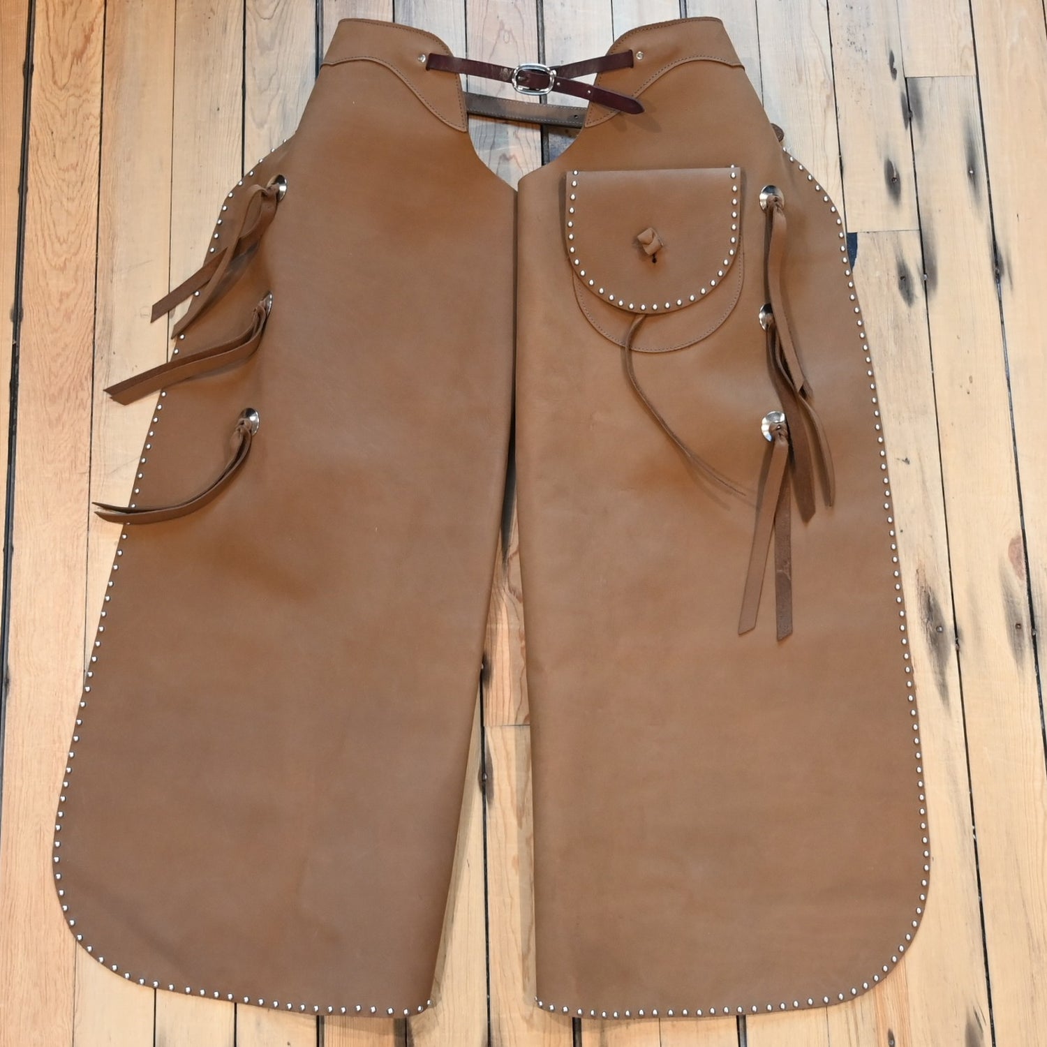 View of K Bar J Batwing Chap in size Medium with rivets and a pocket