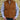 View of Schaefer men’s honey suede vest with Western yoke, fleece-lined pockets, and brass snap closure