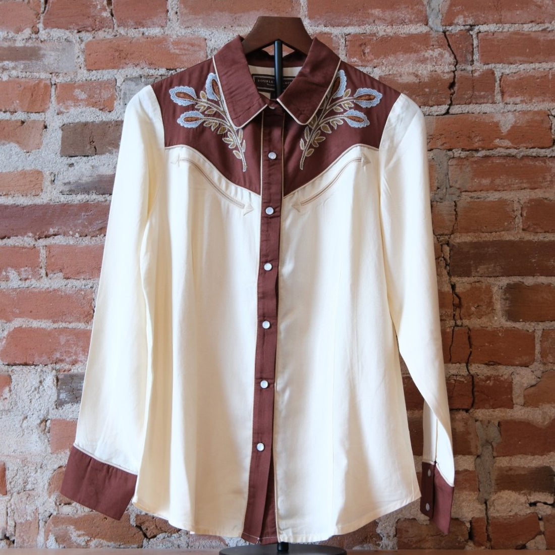 Double D Ranch Wild Bluebonnet Rodeo Top in Bone showing the pearl snap front and bluebonnet embroidery.