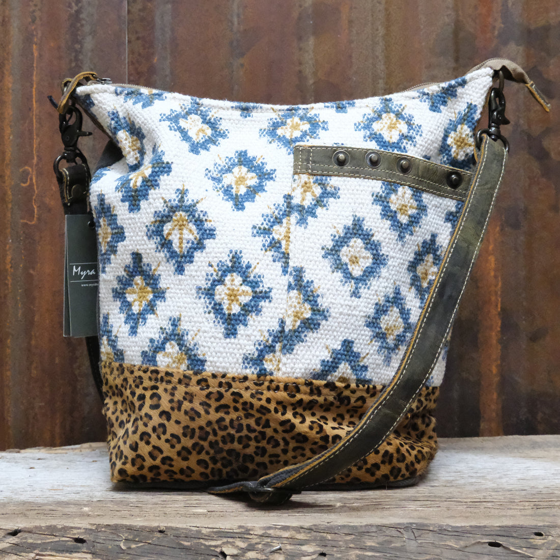 Myra Blue Sapphire printed canvas shoulder bag with leather trim and zipper closure