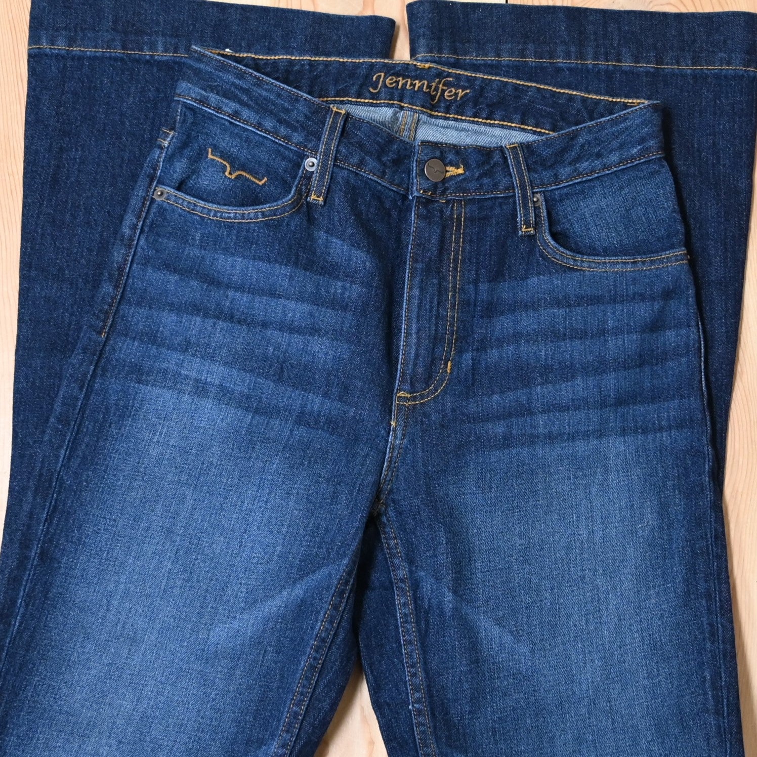 View of Kimes Ranch Jennifer Jeans in Dark Wash, featuring an ultra-high rise and super wide flare leg with hand-sanding and whisker details