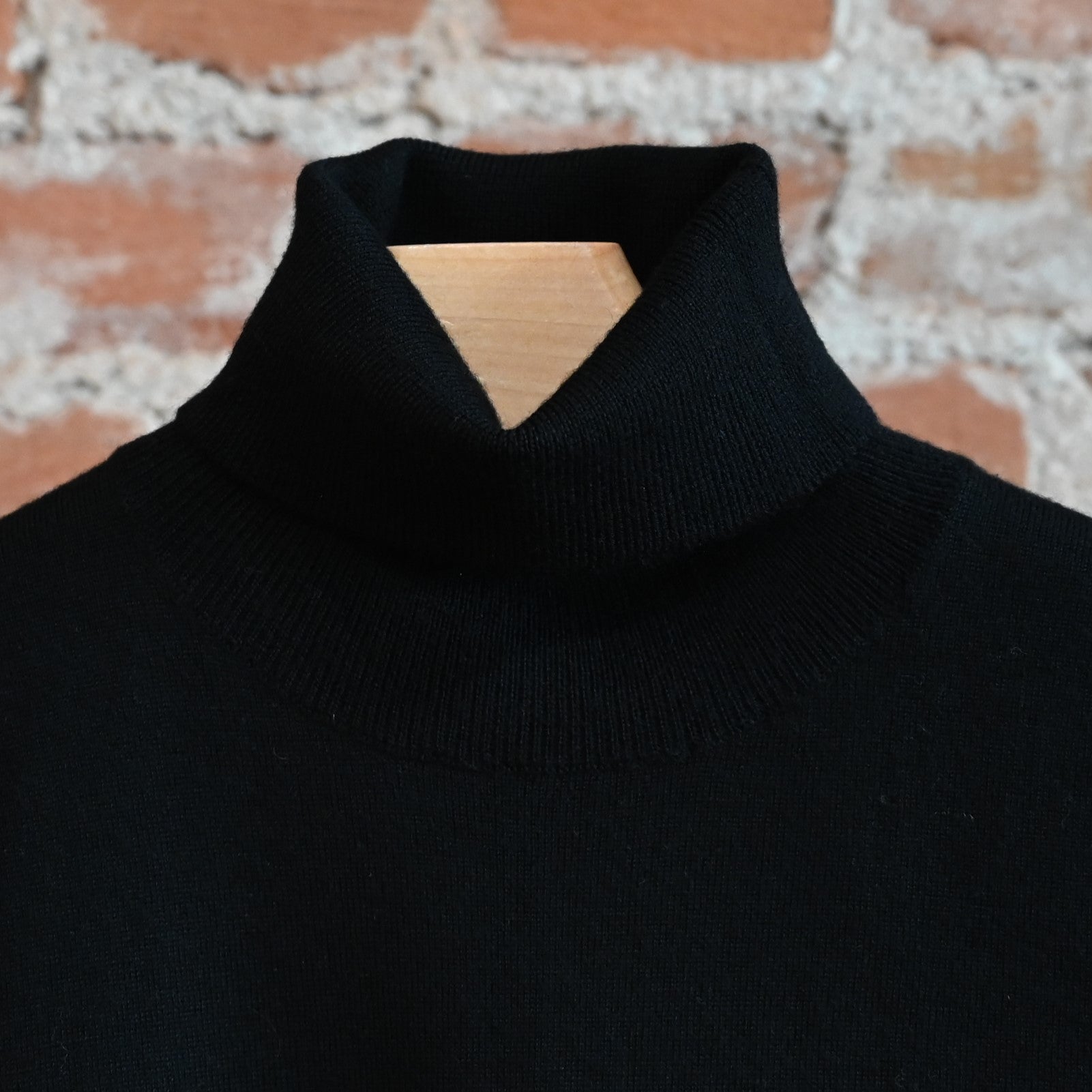 View of Pendleton ladies merino turtleneck in black with ribbed collar and sleeves