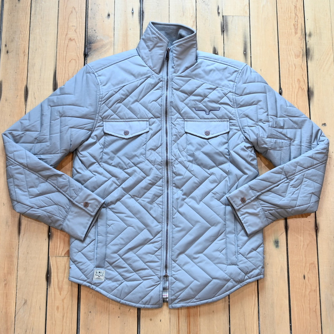 Kimes Ranch men’s Skink quilted jacket with zig-zag pattern, chest flap pockets, and longhorn embroidery