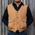 View of Schaefer sherpa-lined canvas vest in suntan with drop-tail hem and five-pocket front