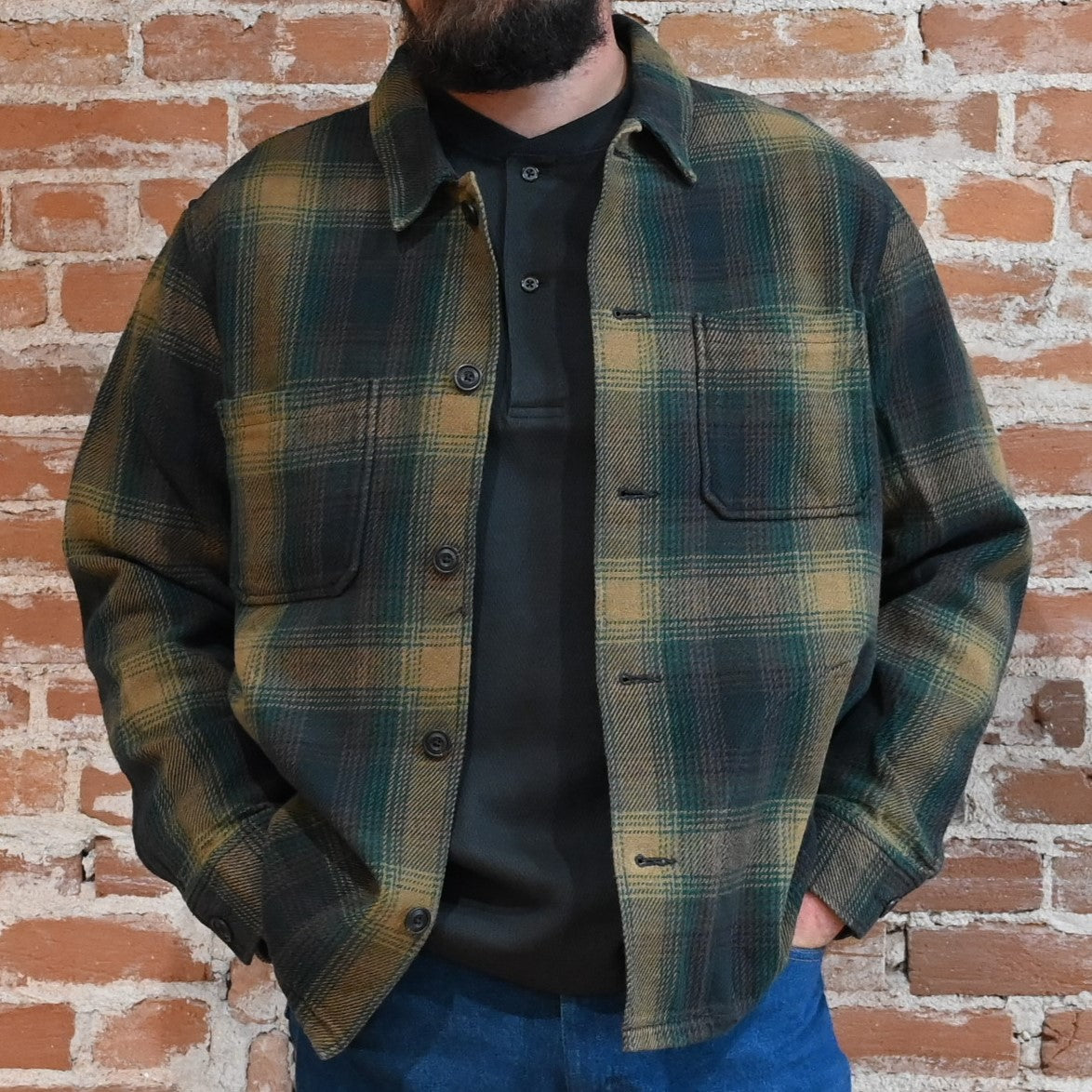 View of Filson Deer Island Ranch Coat in Navy/Red Multi Plaid and Dark Tan/Sycamore Plaid featuring button-front closure and patch pockets