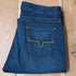 View of Kimes Ranch Betty17 Jeans in Blue, featuring embroidered horns on back pockets and a modest bootcut leg