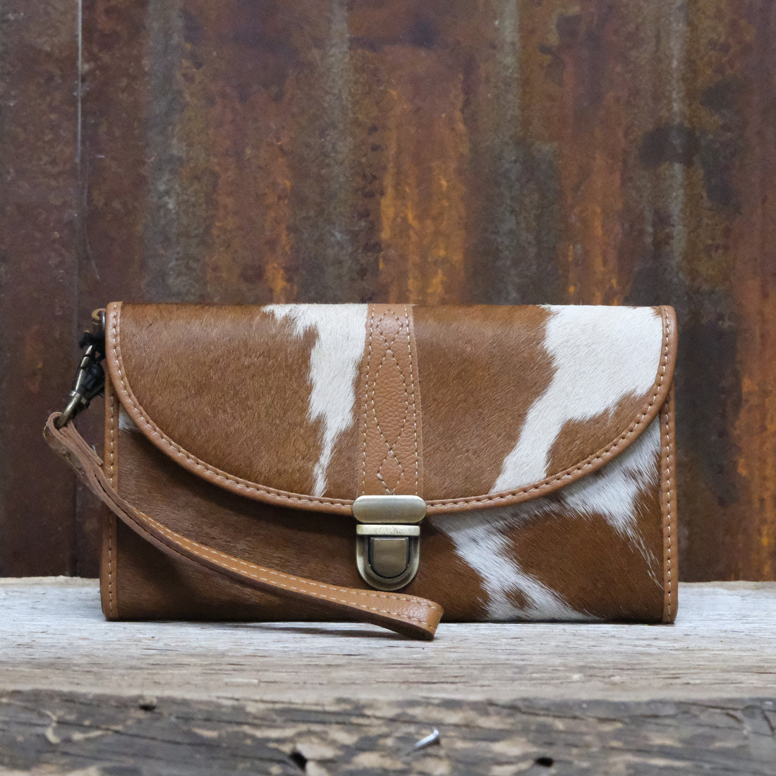 Myra Aria hair-on and leather wallet in brown and white with snap closure