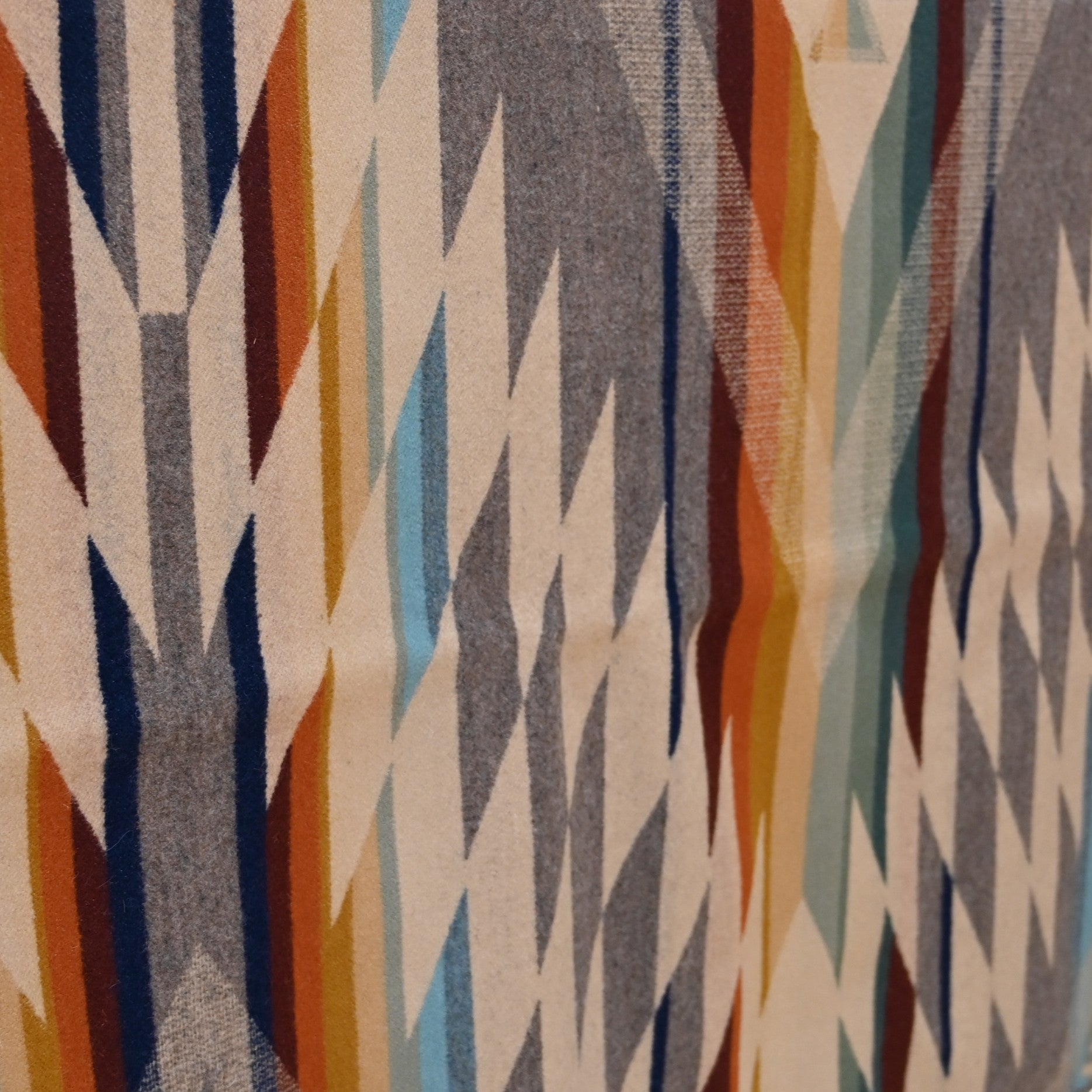 View of Pendleton Summerland Queen blanket in Taupe Multi with reversible jacquard design