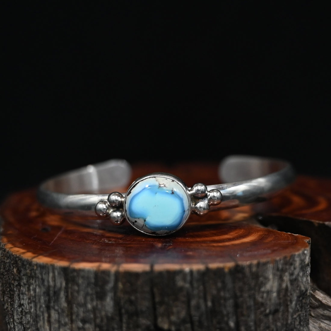 View of Sunwest Silver Paul Livingston Golden Hills One Stone Cuff featuring a light blue Golden Hills turquoise stone set in sterling silver