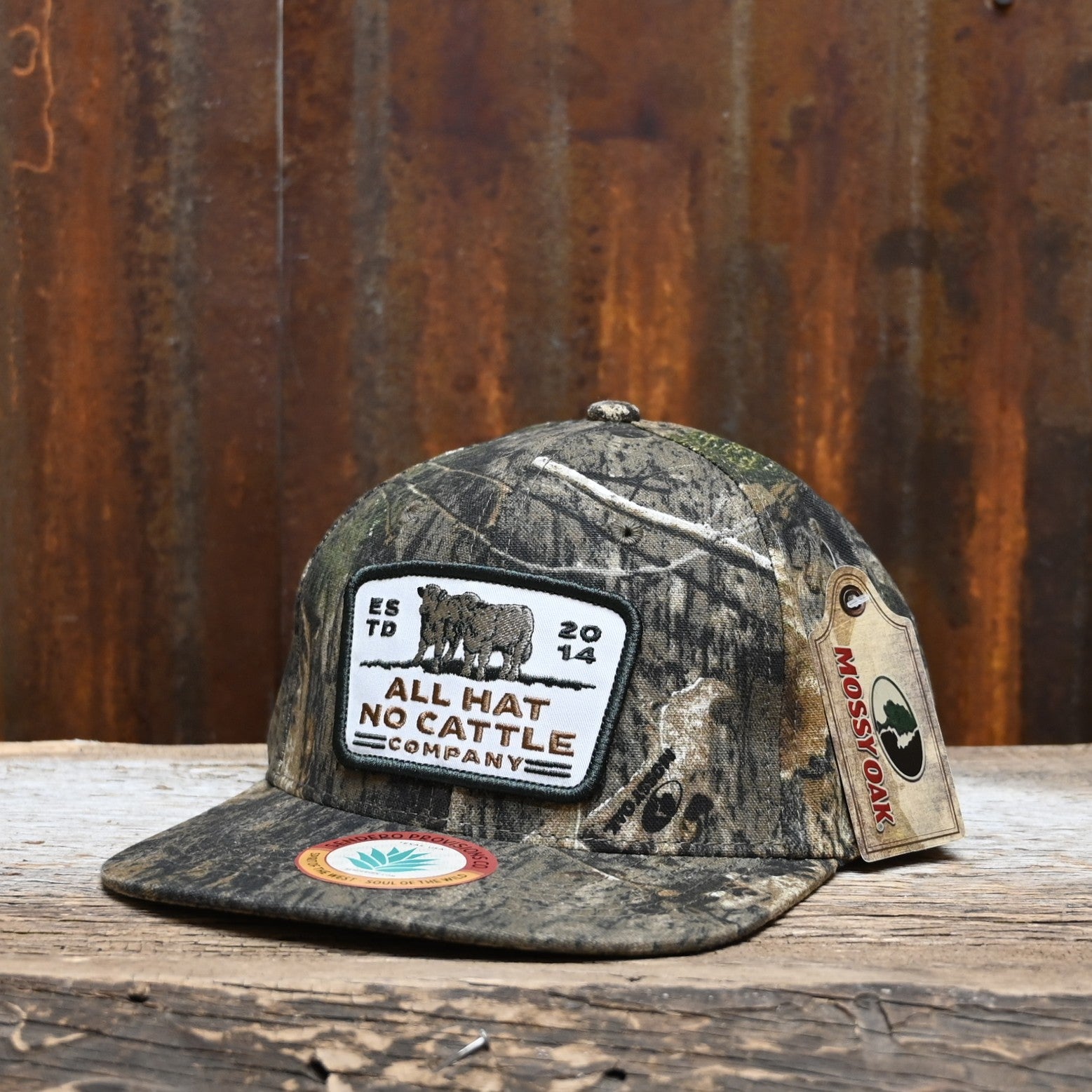 View of Sendero “All Hat No Cattle” Hat with full Mossy Oak camo and embroidered patch