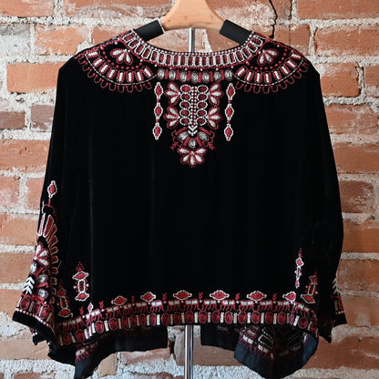 View of Johnny Was black velvet bolero with red and white embroidered floral trim