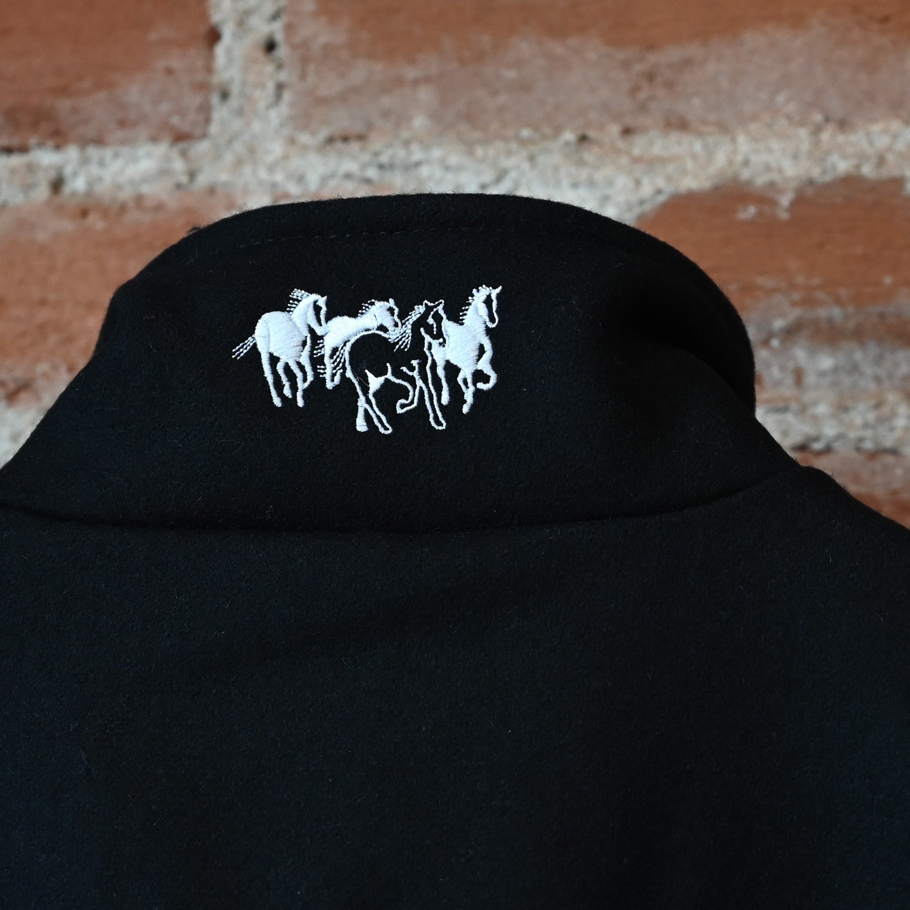 Schaefer ladies black wool arena jacket with Western yoke and two-way zipper