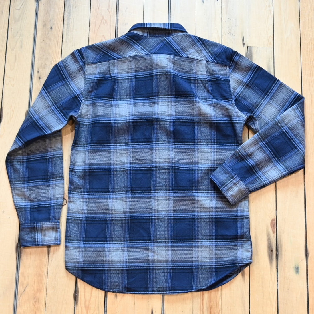 Filson Vintage Flannel Work Shirt in light blue and navy plaid with button-front closure and chest pockets
