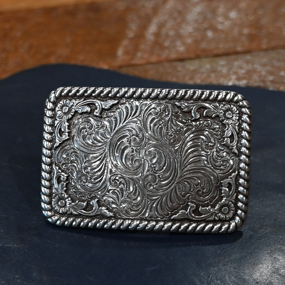 Nocona rectangle buckle with rope border and engraved floral and scroll design