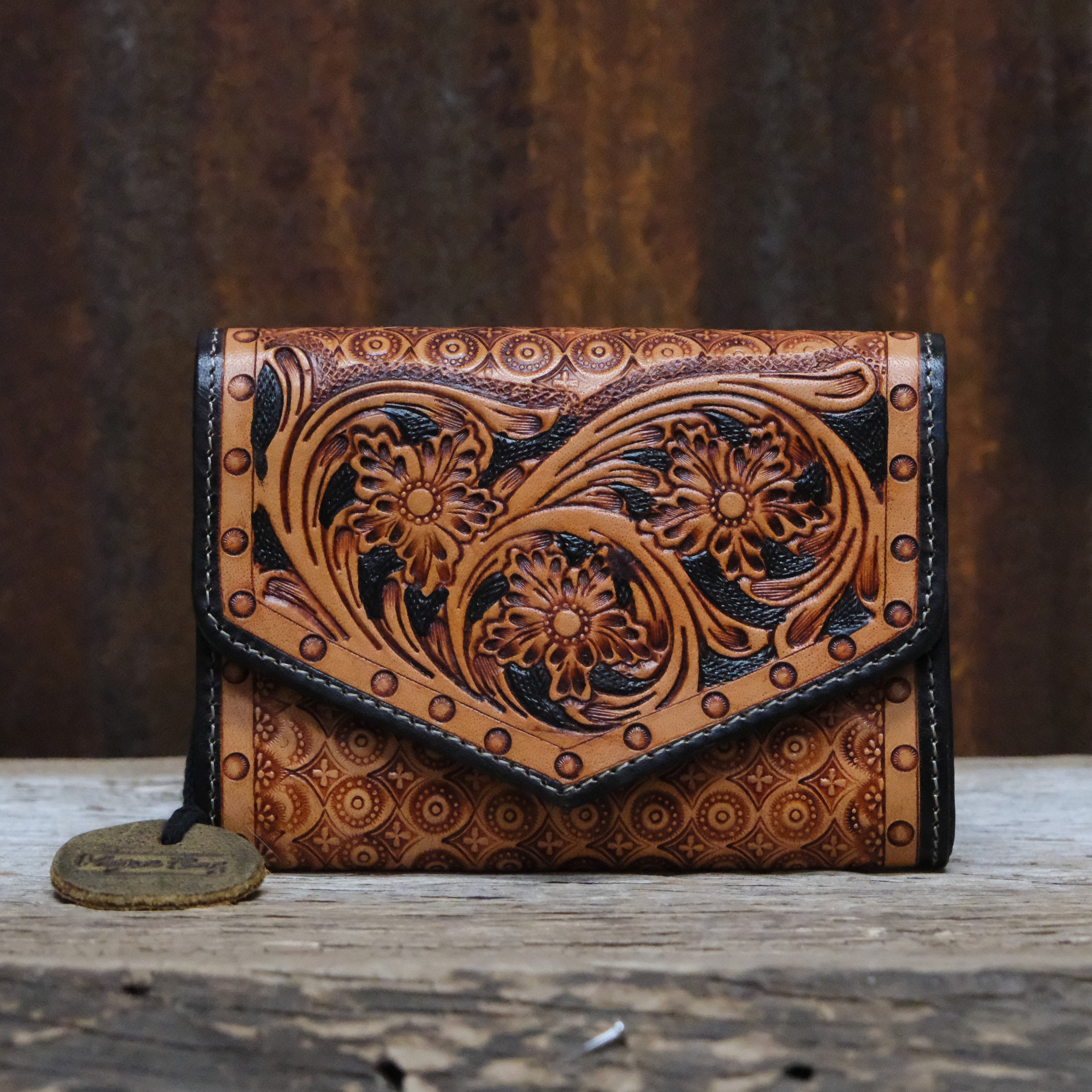 Myra orange and black printed canvas wallet with leather trim and zipper closure