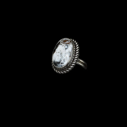 Sunwest Silver White Buffalo Turquoise Ring with rope border in sterling silver, featuring bold black-and-white veined stone, size 8