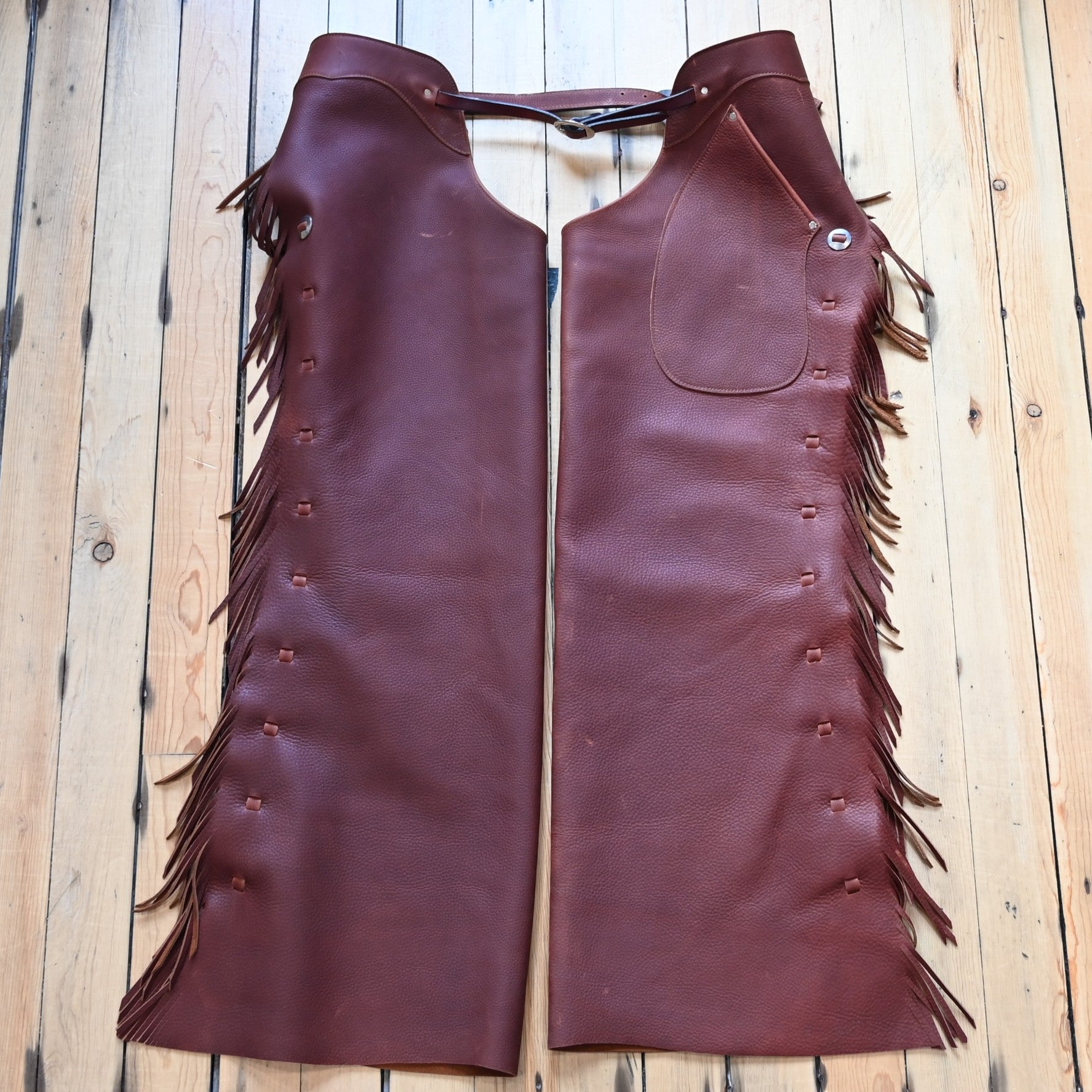 View of K Bar J Cowboy Basic Shotgun Chaps in Size X-Large with fringe and buckle closures