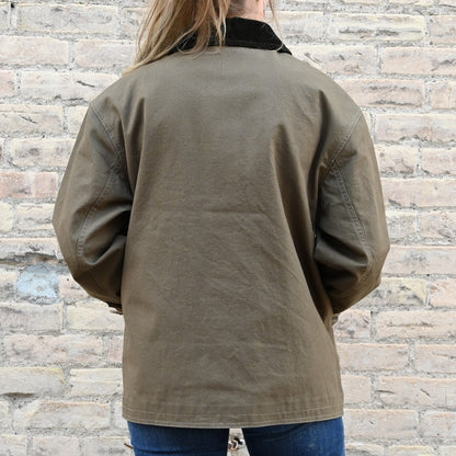 View of Filson Ladies Barn Coat in Marsh Olive featuring button-front closure and corduroy-lined collar