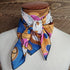 Cowboy Images 44×44 silk wild rag in toffee, caramel and pink tones