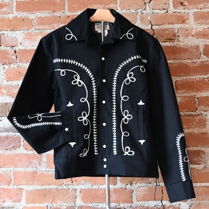 View of Rockmount vintage black gabardine bolero jacket with embroidery and snaps