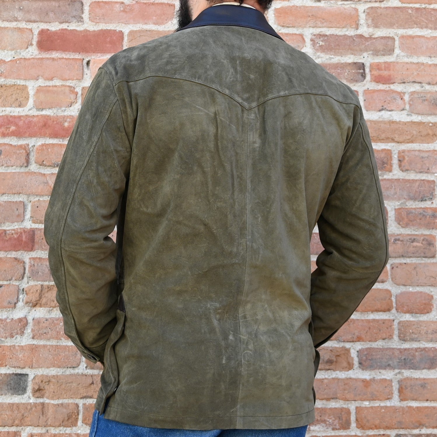 View of Schaefer olive suede jacket with leather collar, button front, and Western fit