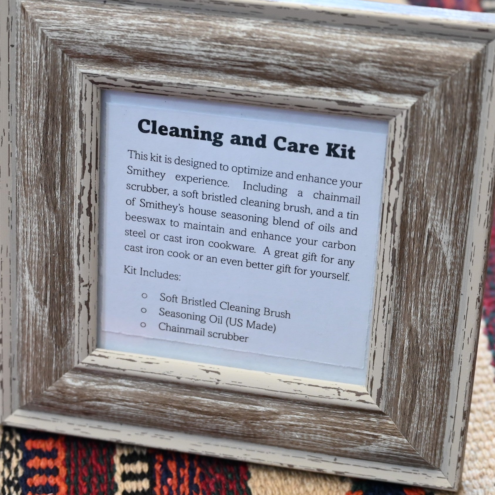 View of Smithey Ironware Cleaning &amp; Care Kit: chainmail scrubber, seasoning oil, and cleaning brush 