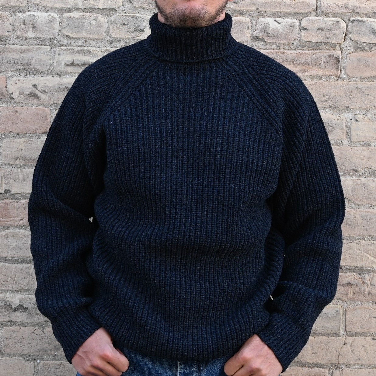 View of Filson Bristol Roll Neck Sweater in Dark Navy Heather featuring vertical fisherman&