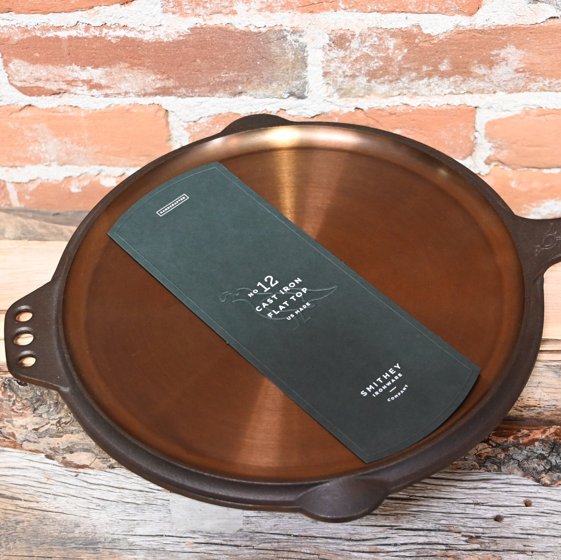 View of Smithey Ironware No. 12 Flat Top Griddle made from cast iron with a polished surface