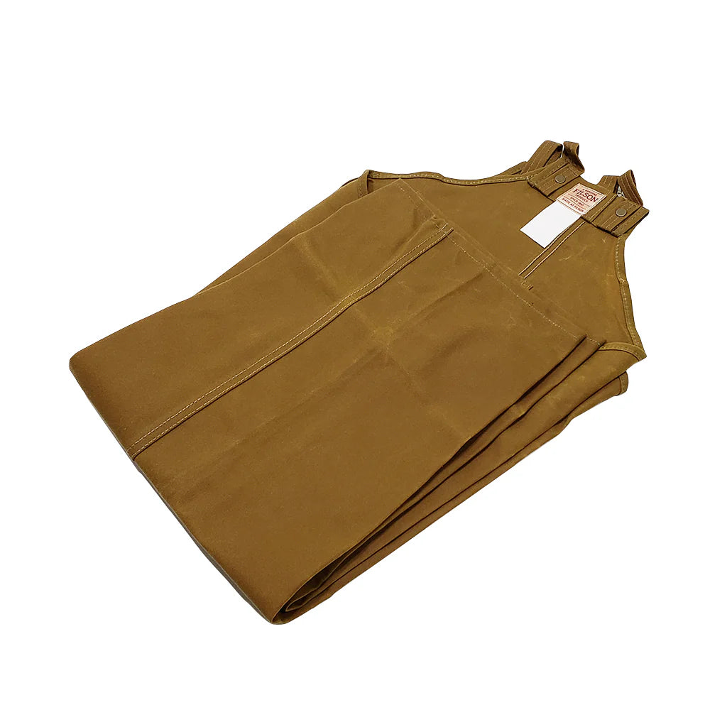 Filson dark tan single tin cloth chaps with adjustable snaps and reinforced stitching