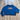 View of Kimes Ranch Ladies Colfax Crew Sweatshirt in Mid Blue, featuring an oversized fit, ribbed hem, and embroidered logo