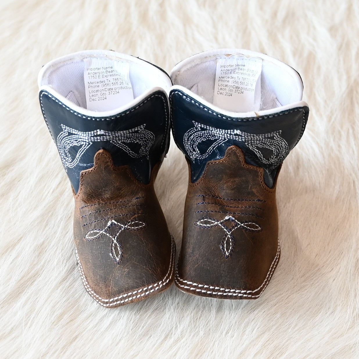 View of Anderson Bean Baby Bean boot with tan Crazy Horse vamp, navy glove top, and DB square toe