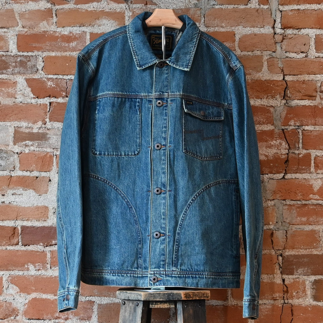 Howler Bros Denim Depot Jacket in Petty Mid Wash — front view, chest pocket, snap cuffs