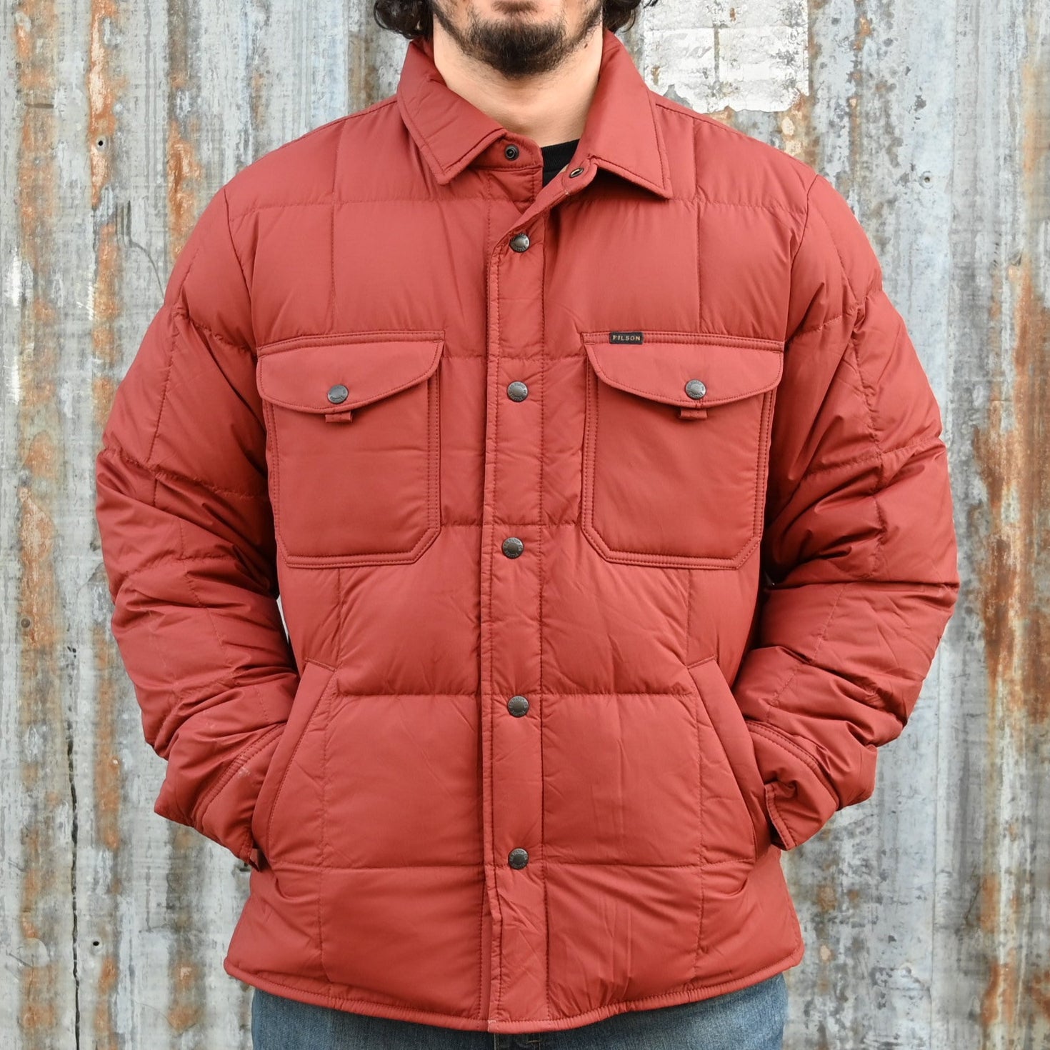 View of Filson Lightweight Down Jac-Shirt in Madder Red featuring snap-front closure, chest pockets, and flannel-lined handwarmer pockets