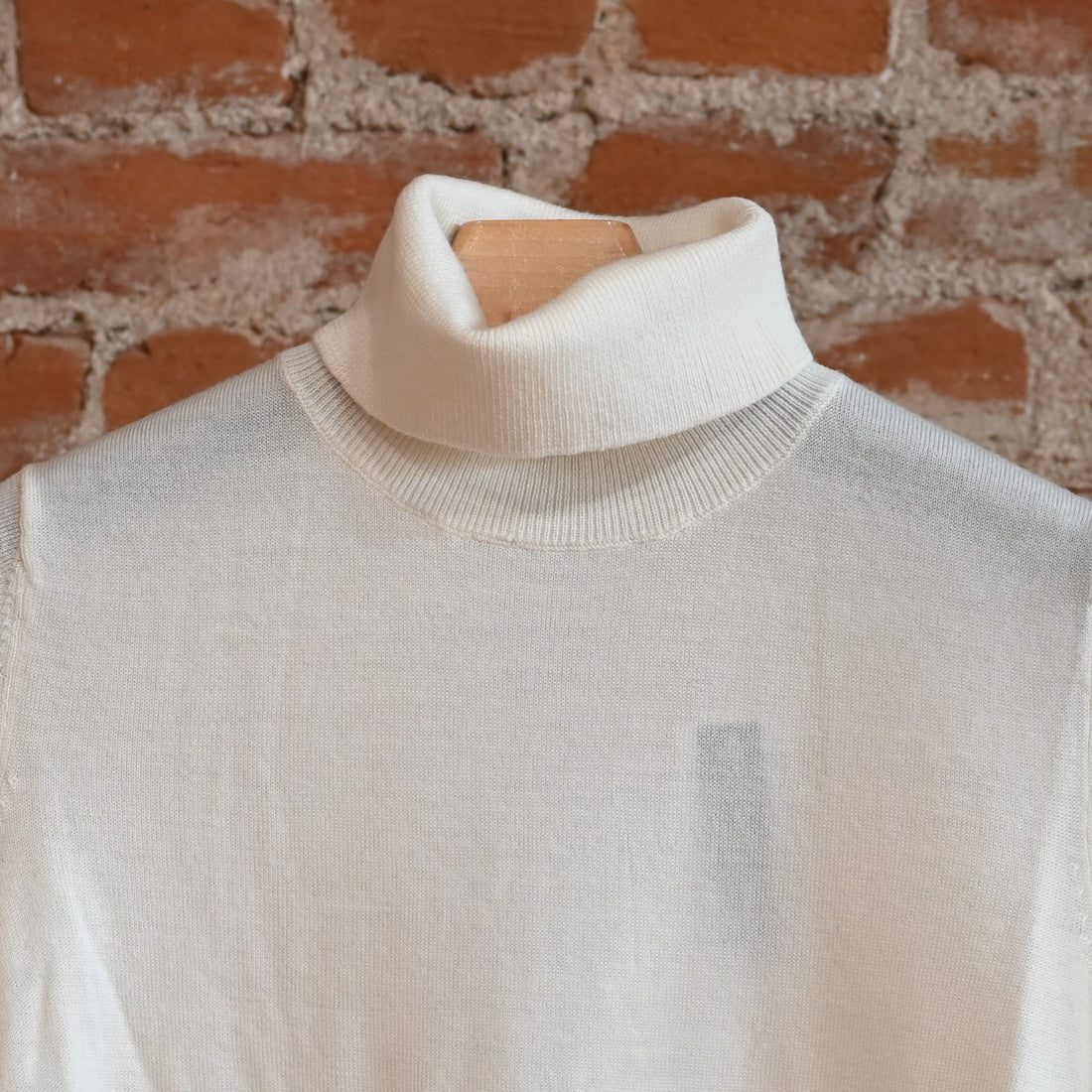 View of Pendleton ladies ivory merino turtleneck sweater with raglan sleeves and ribbed edges