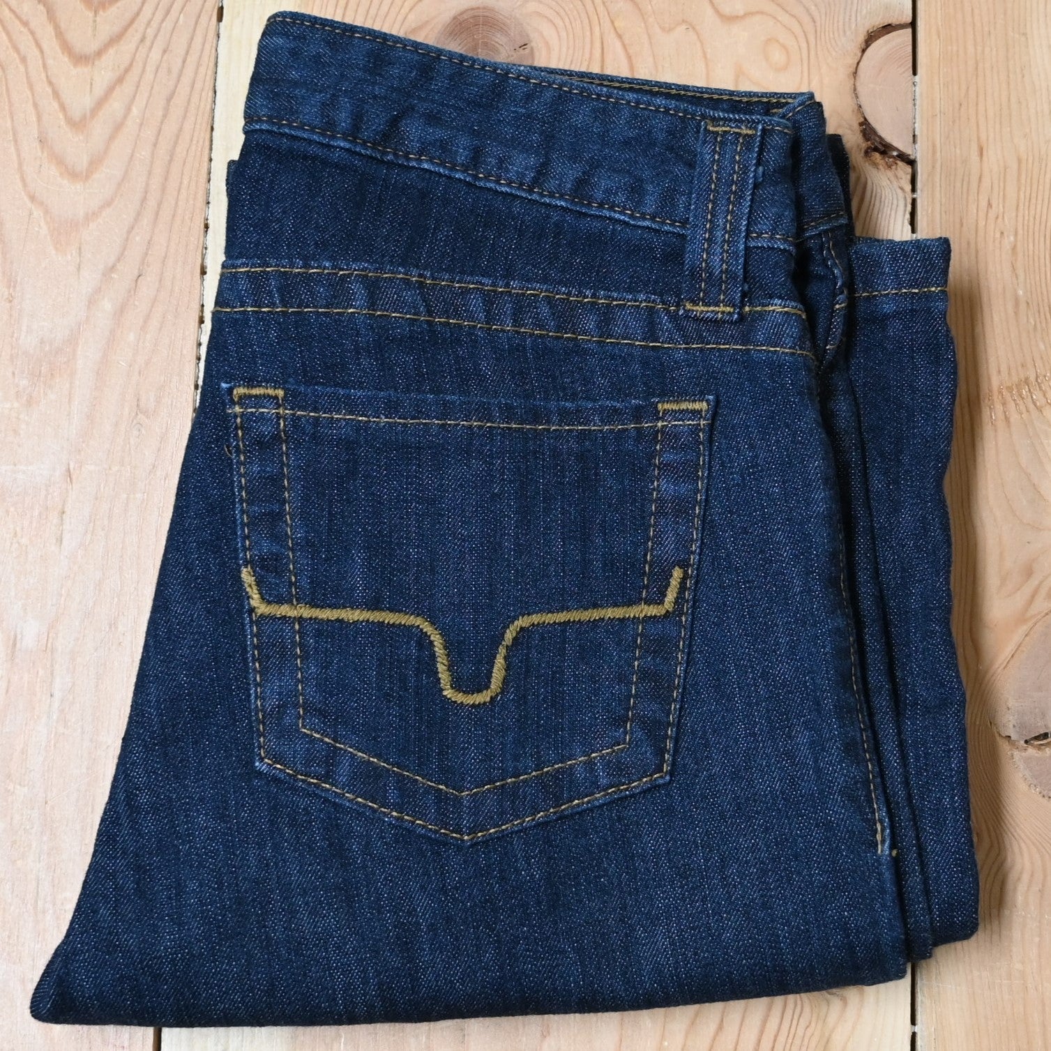 View of Kimes Ranch Betty Jeans in Blue, featuring embroidered horns on back pockets and a modest bootcut leg