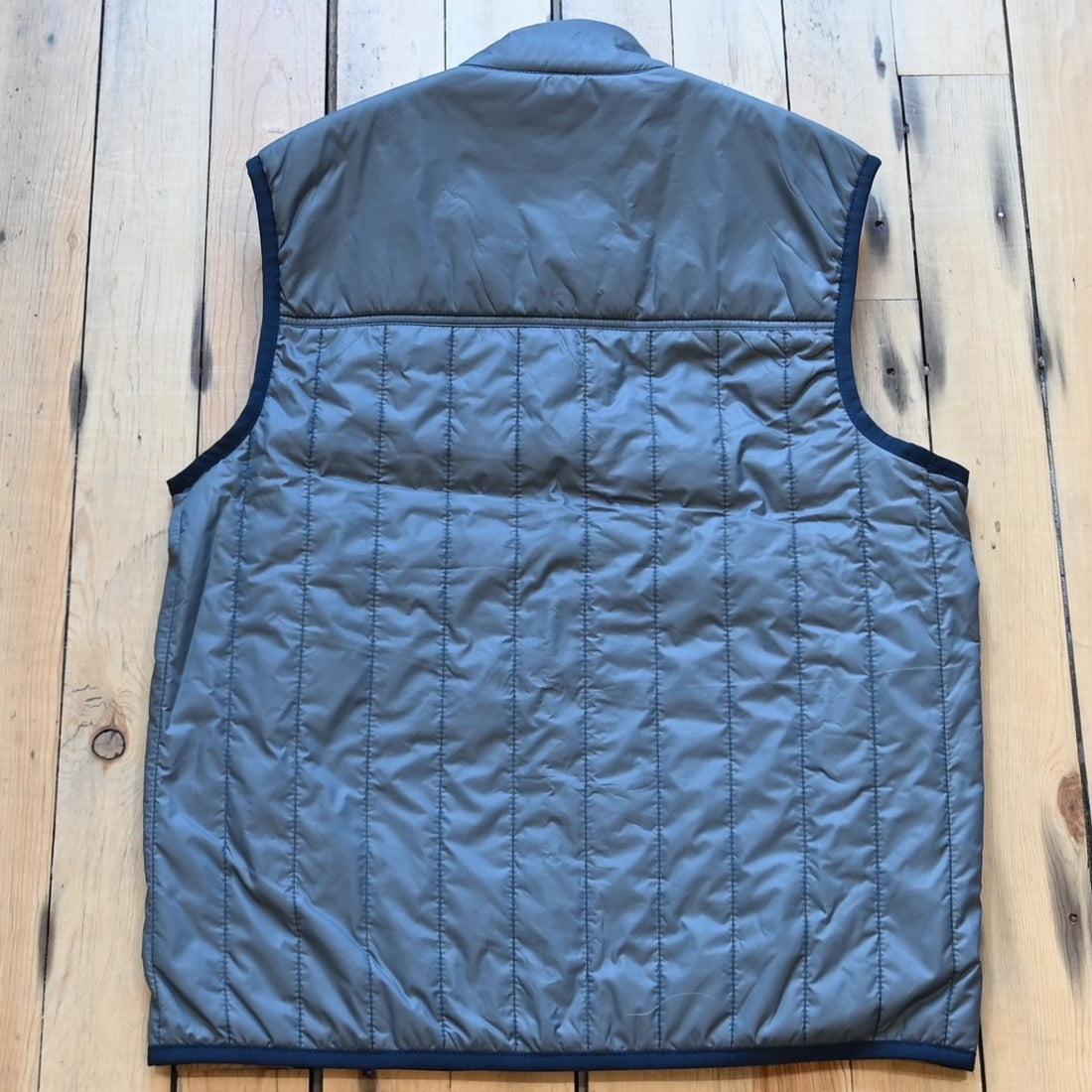 View of Filson Ultralight Vest in Storm Blue, showcasing its lightweight design and insulated features